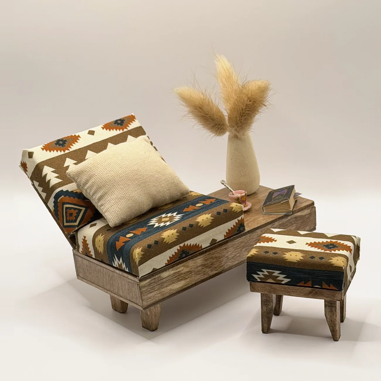The Santa Fe Lounge Set, a miniature seat with angled back and built-in side table in geometric southwestern upholstery, with a matching ottoman.